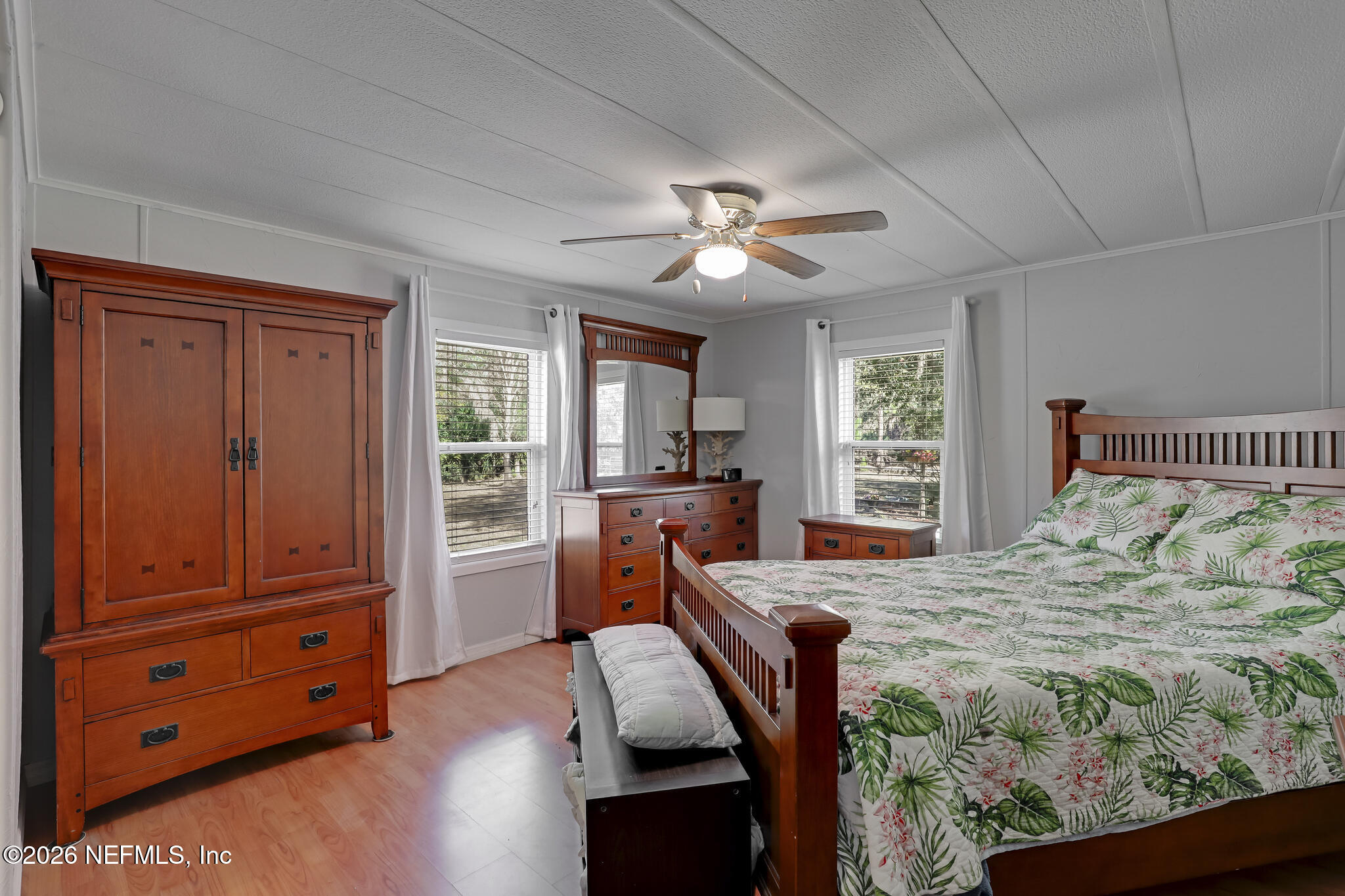 6901 Catlett Road St. Augustine, FL 32095 - Photo 19 of 74 a bedroom with a bed and wooden floor