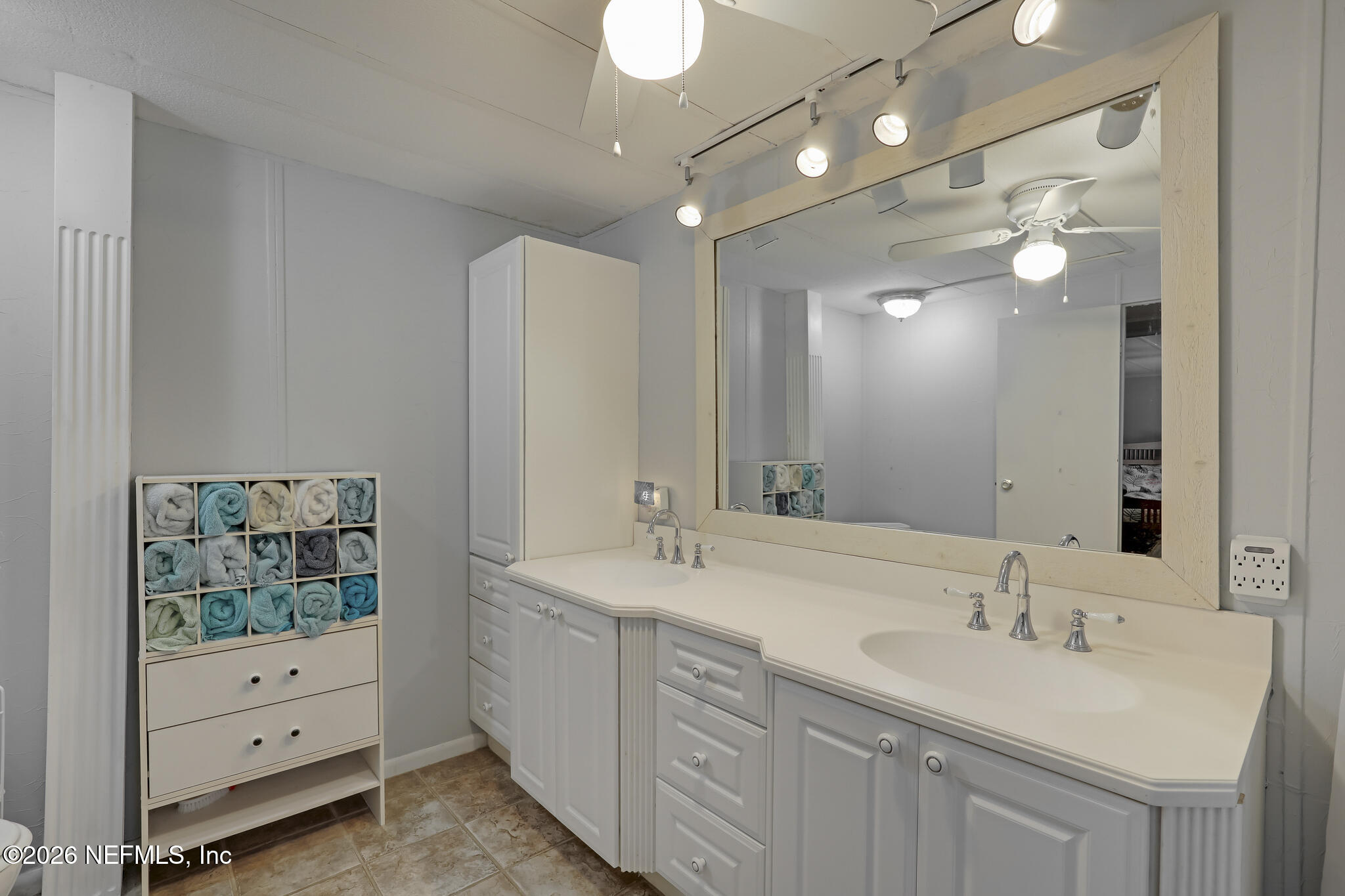 6901 Catlett Road St. Augustine, FL 32095 - Photo 23 of 74 a bathroom with a double vanity sink a mirror and a shower