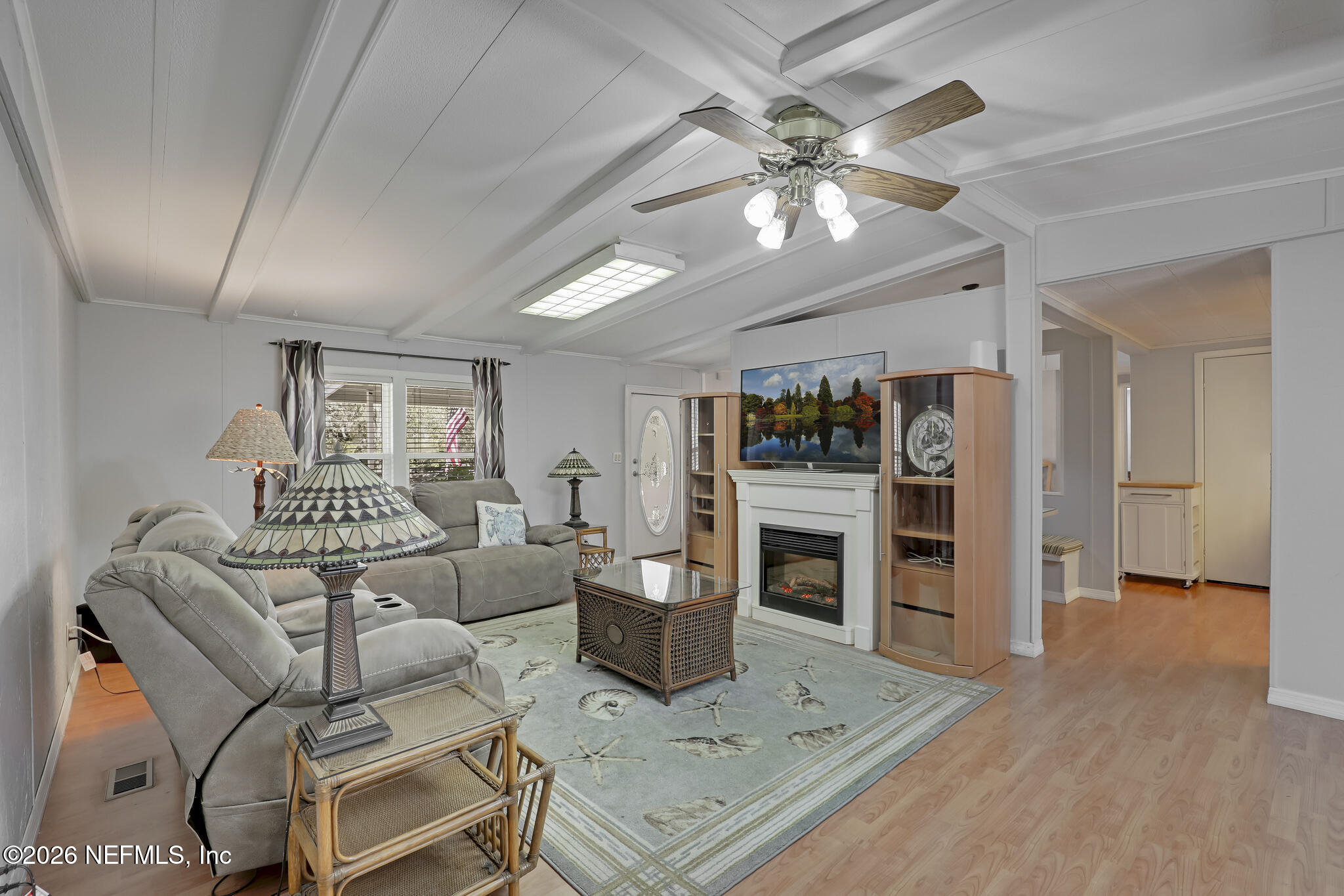 6901 Catlett Road St. Augustine, FL 32095 - Photo 3 of 74 a living room with furniture a fireplace and a flat screen tv