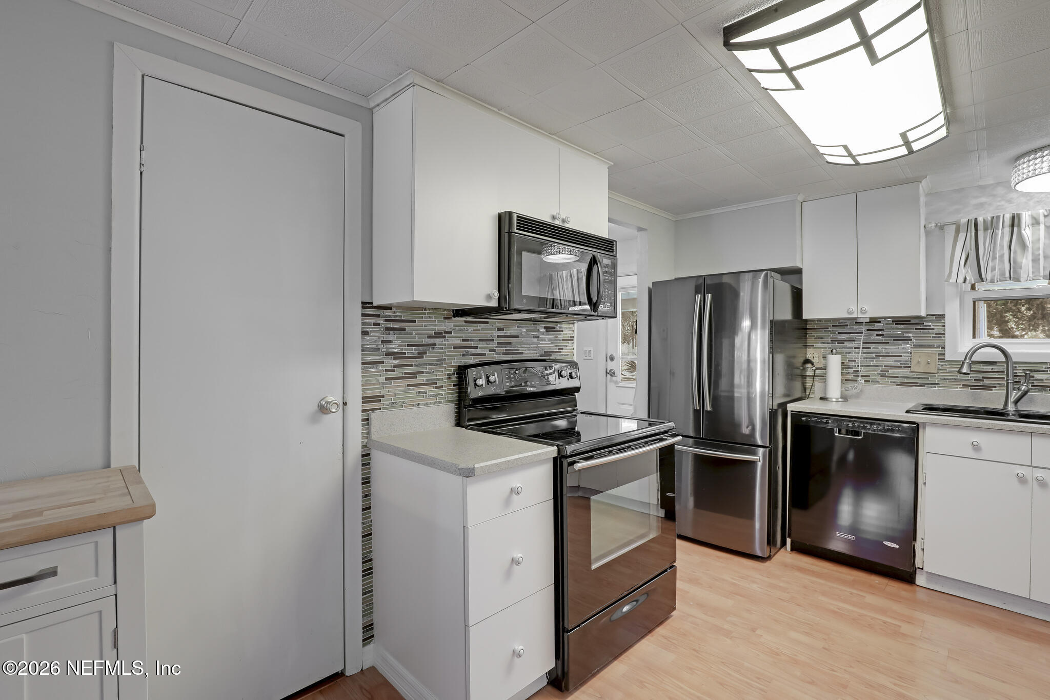 6901 Catlett Road St. Augustine, FL 32095 - Photo 33 of 74 a kitchen with stainless steel appliances a refrigerator stove and sink