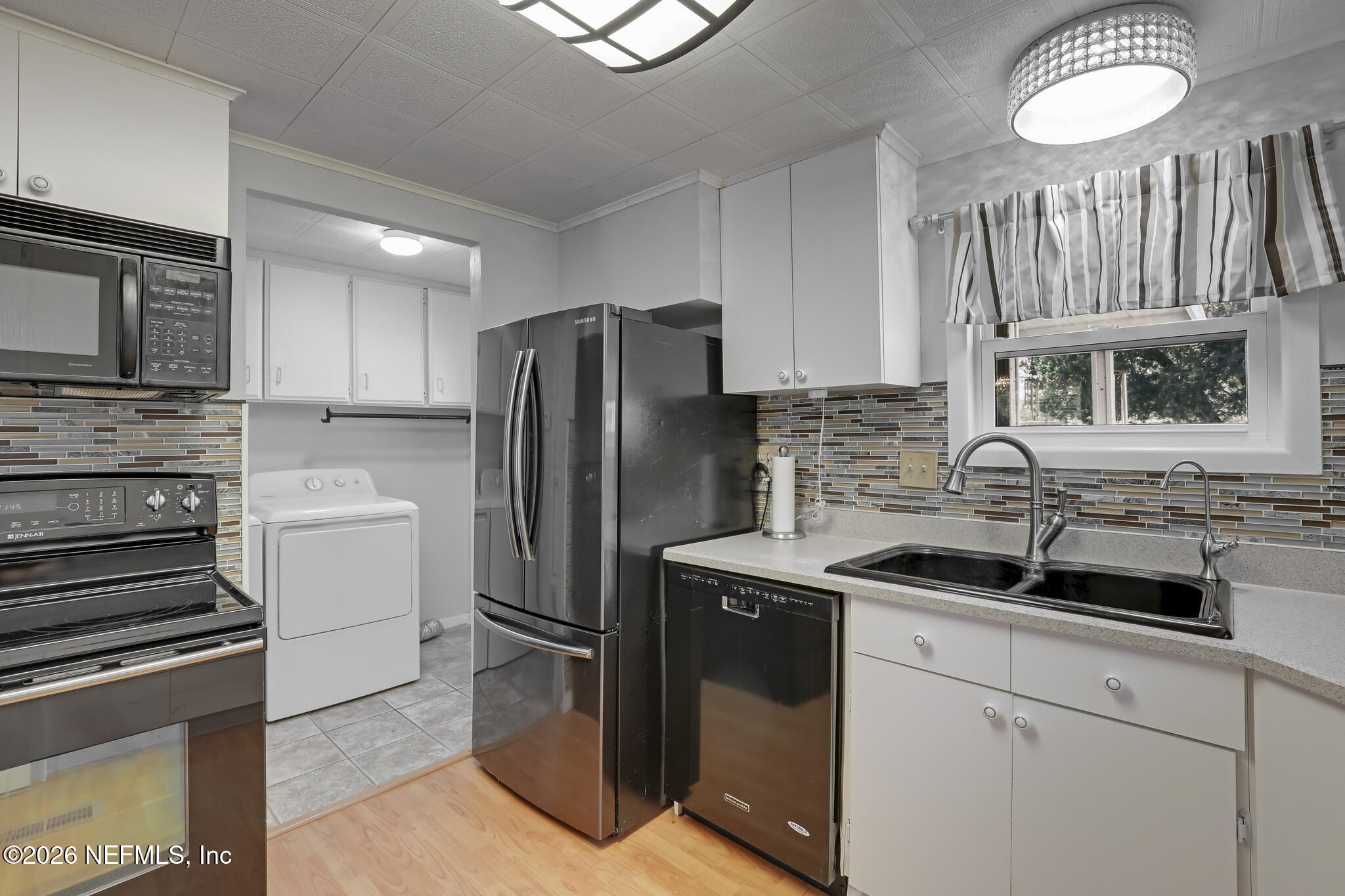 6901 Catlett Road St. Augustine, FL 32095 - Photo 34 of 74 a kitchen with a sink stove and refrigerator