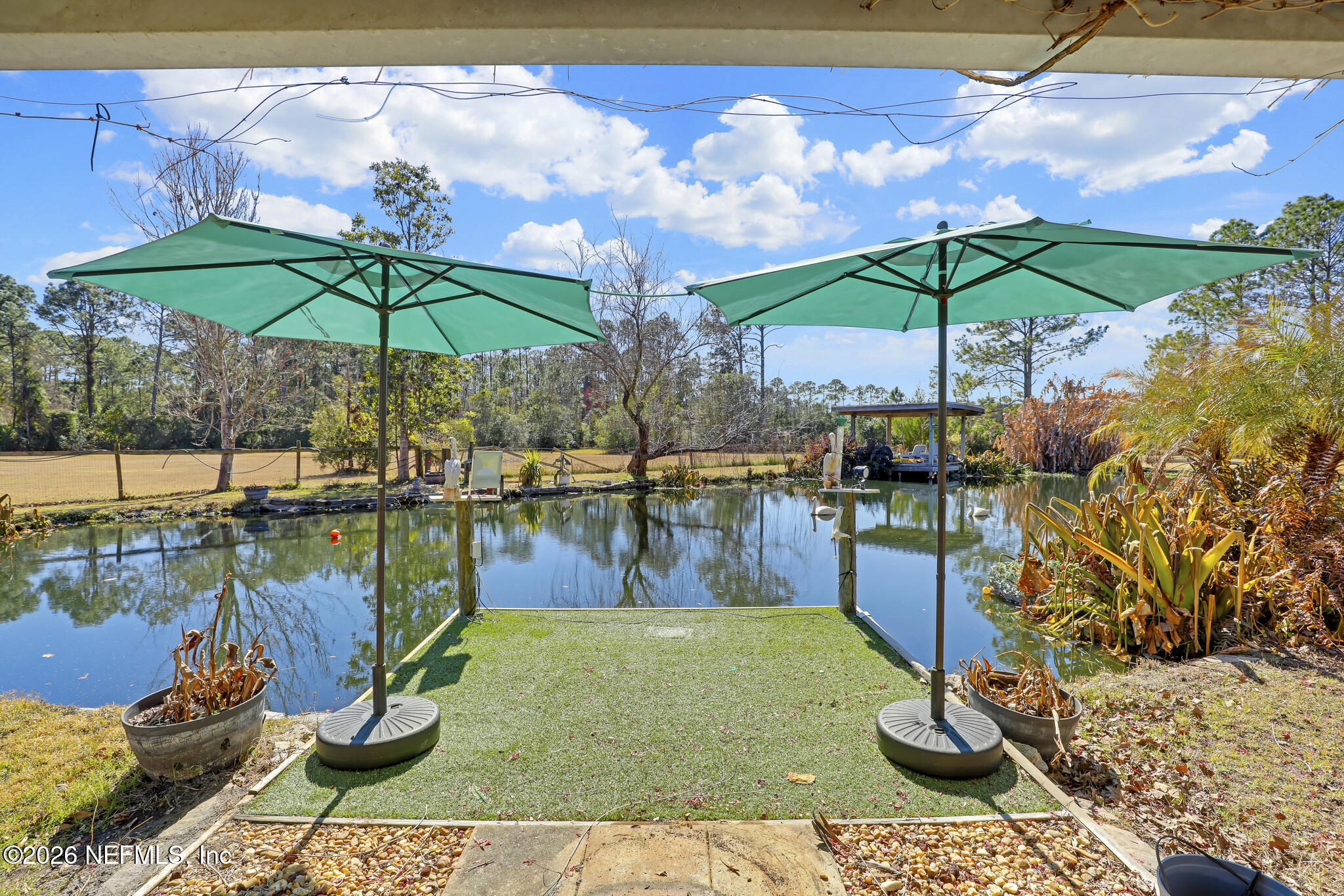 6901 Catlett Road St. Augustine, FL 32095 - Photo 58 of 74 a swimming pool with an outdoor seating and yard
