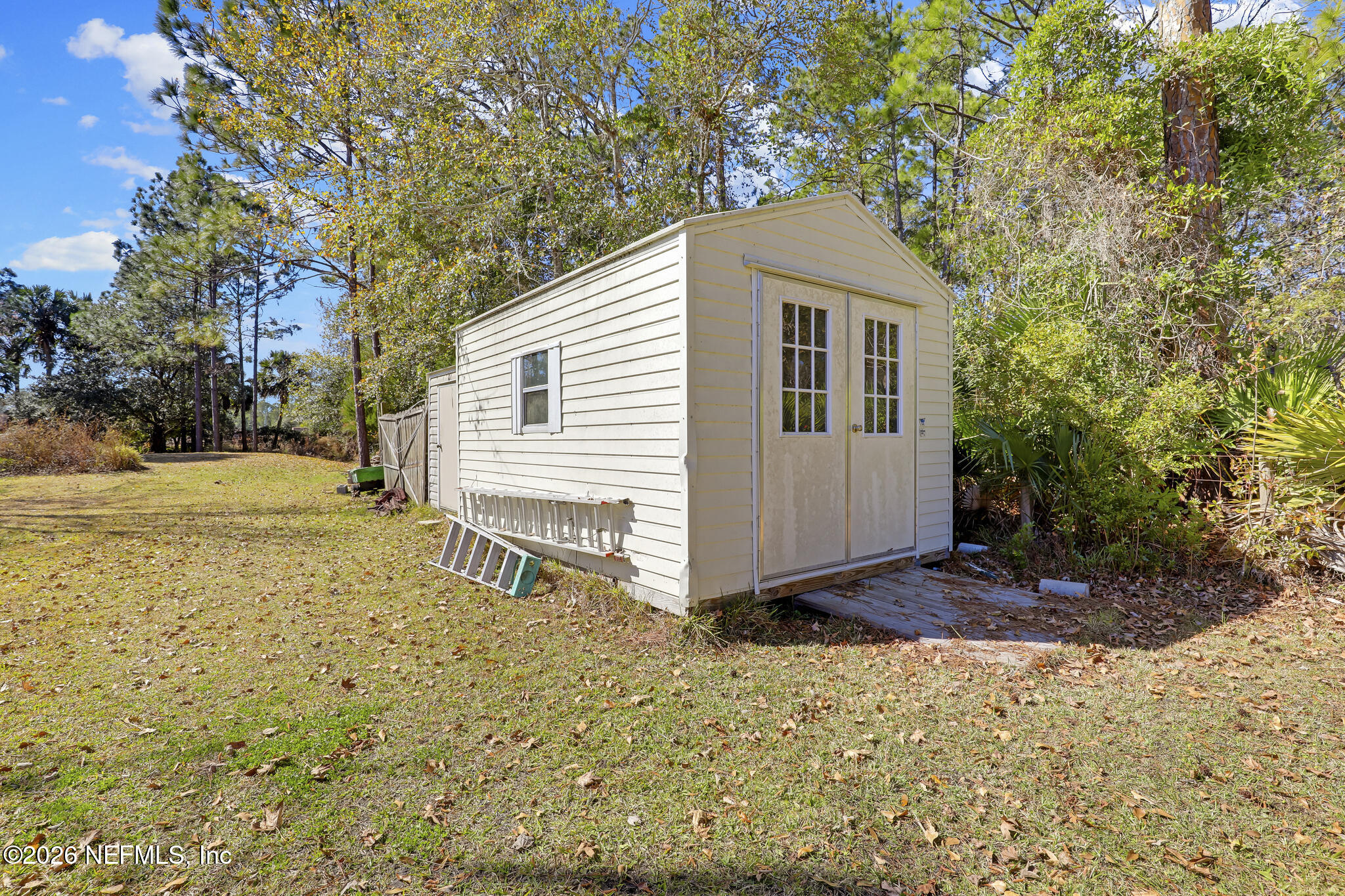 6901 Catlett Road St. Augustine, FL 32095 - Photo 60 of 74 a front view of a house with a yard