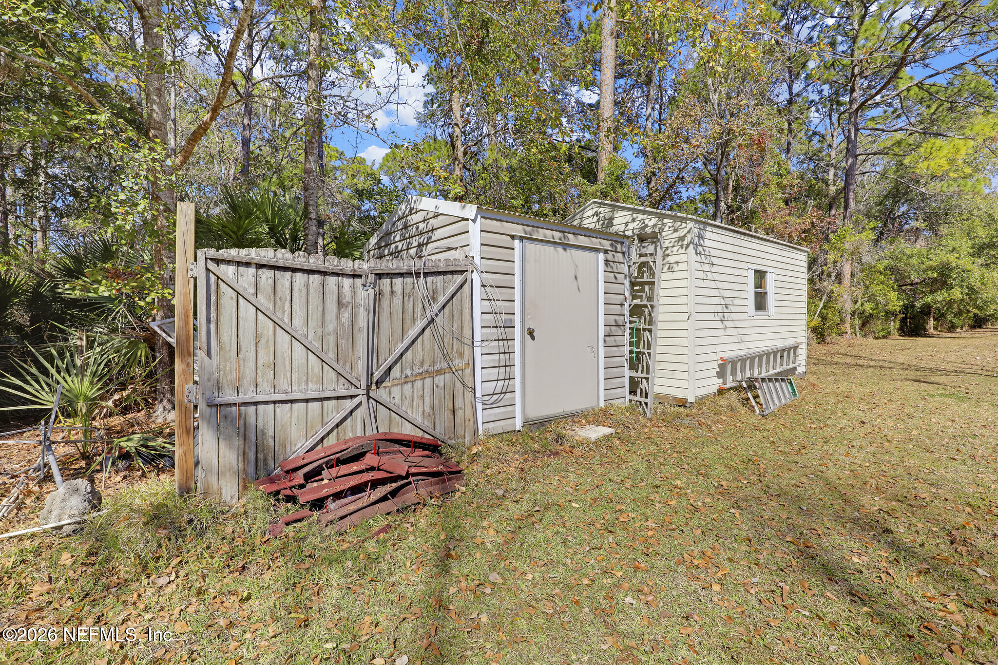 6901 Catlett Road St. Augustine, FL 32095 - Photo 61 of 74 a white house that has a tree in front of it