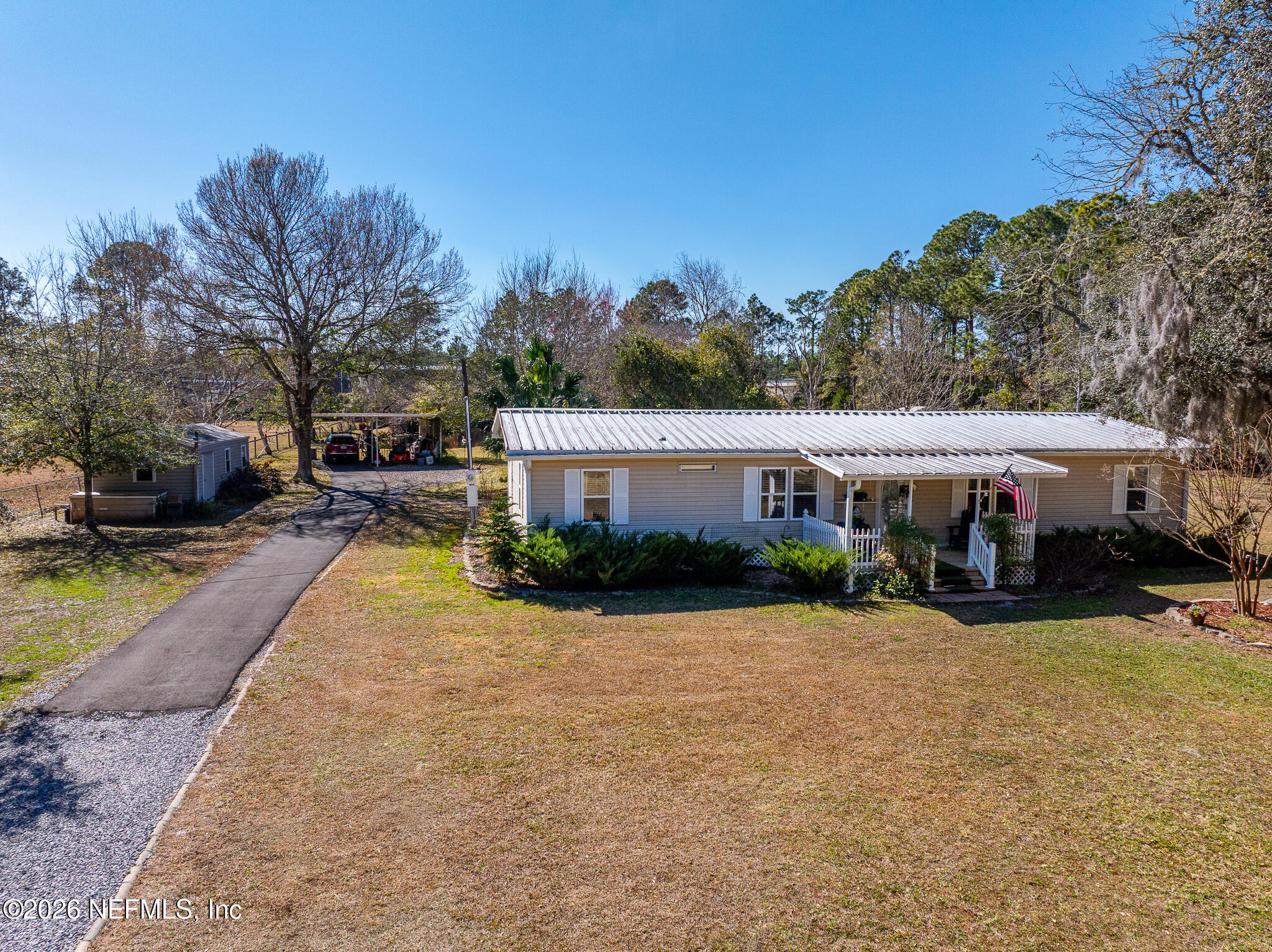 6901 Catlett Road St. Augustine, FL 32095 - Photo 66 of 74 a view of a house with garden and pathway