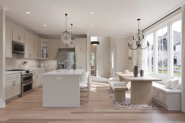 a large kitchen with a table and chairs