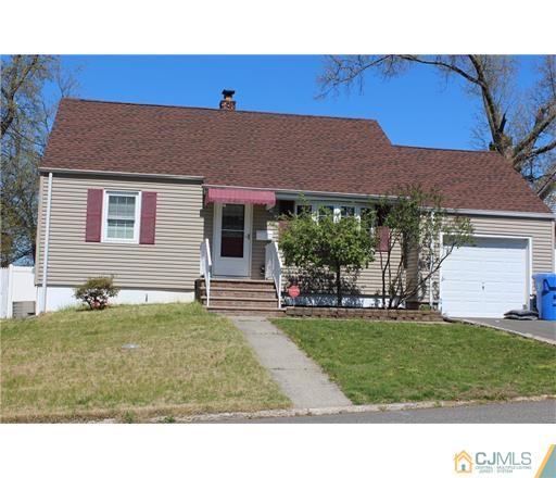 20 Dover Road Colonia, NJ 07067 - Photo 1 of 19 a backyard of a house with table and chairs