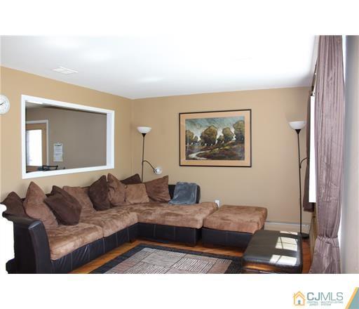 20 Dover Road Colonia, NJ 07067 - Photo 2 of 19 a living room with furniture and a window