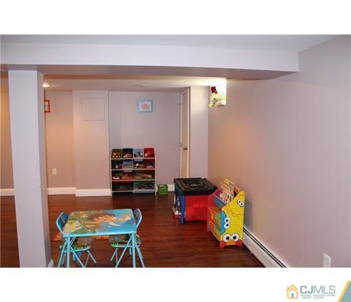 20 Dover Road Colonia, NJ 07067 - Photo 12 of 19 a living room with furniture and a wooden floor