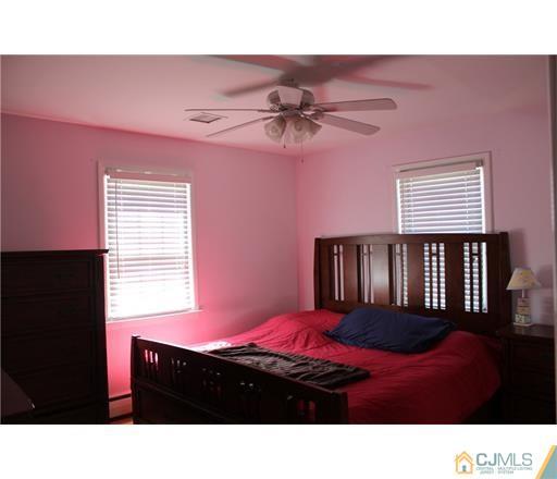 20 Dover Road Colonia, NJ 07067 - Photo 4 of 19 a bedroom with a bed dresser and a window