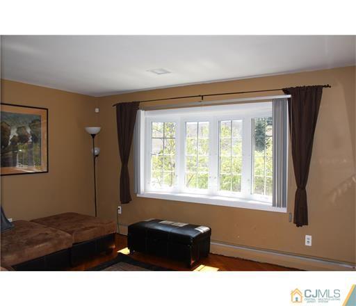 20 Dover Road Colonia, NJ 07067 - Photo 7 of 19 a living room with furniture and a window