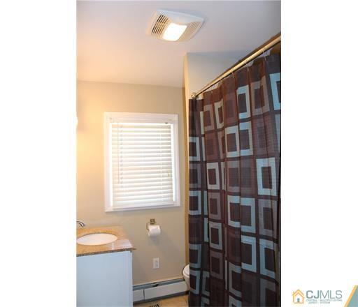 20 Dover Road Colonia, NJ 07067 - Photo 10 of 19 a view of walk in closet with clothes and shoes