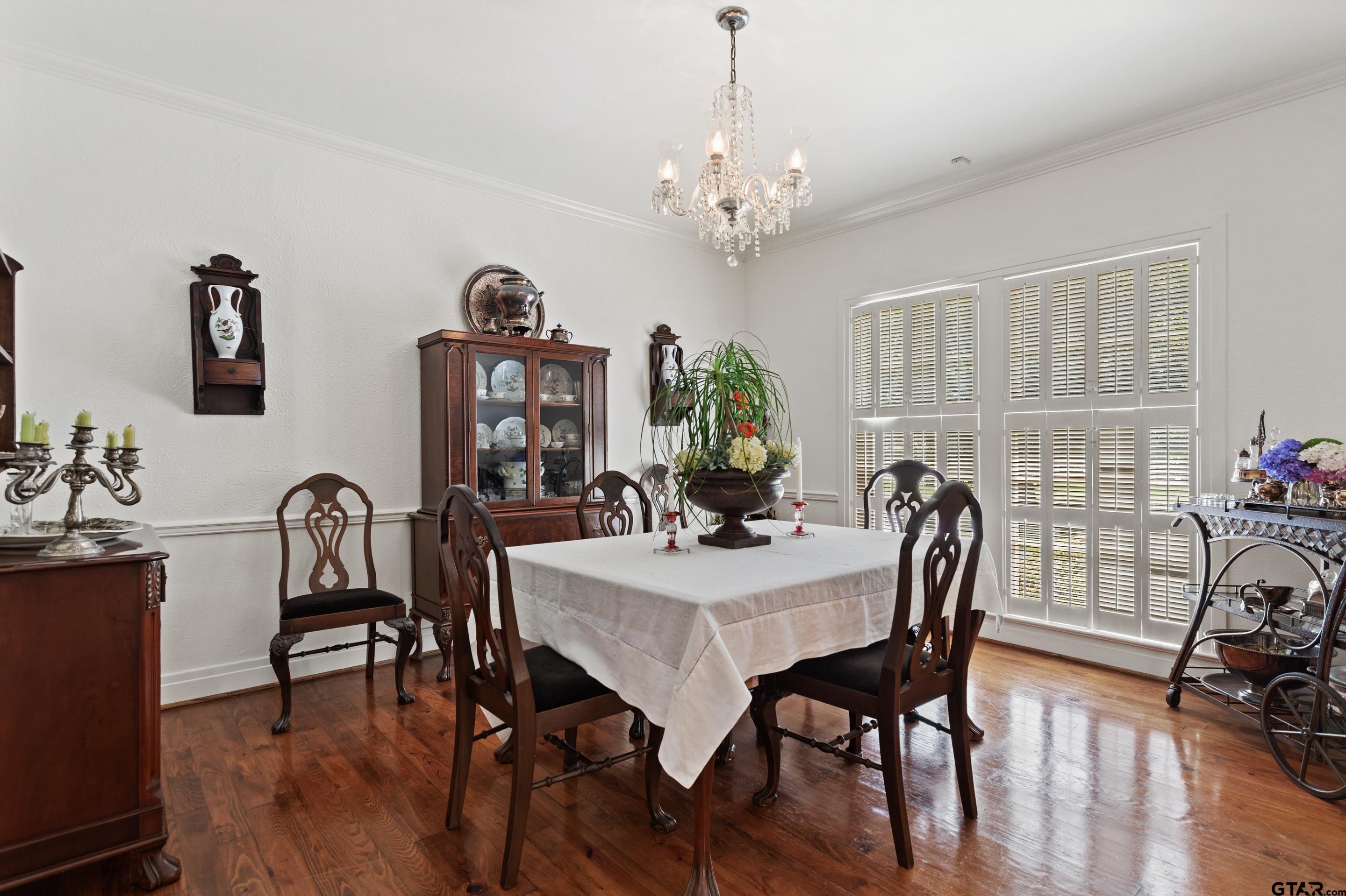 2631 Old Bullard Road Tyler, TX 75701 - Photo 7 of 43 a view of a dining room with furniture wooden floor and chandelier