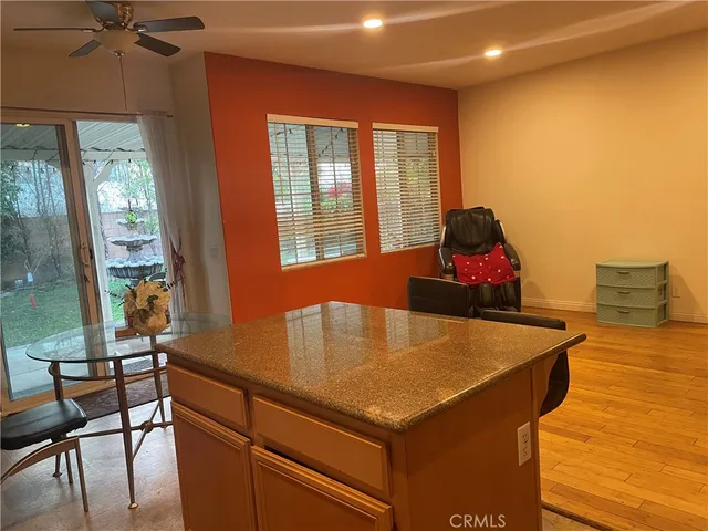 a view of a dining room with furniture and window