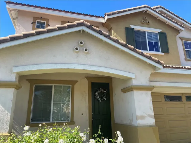 a front view of a house with a garage