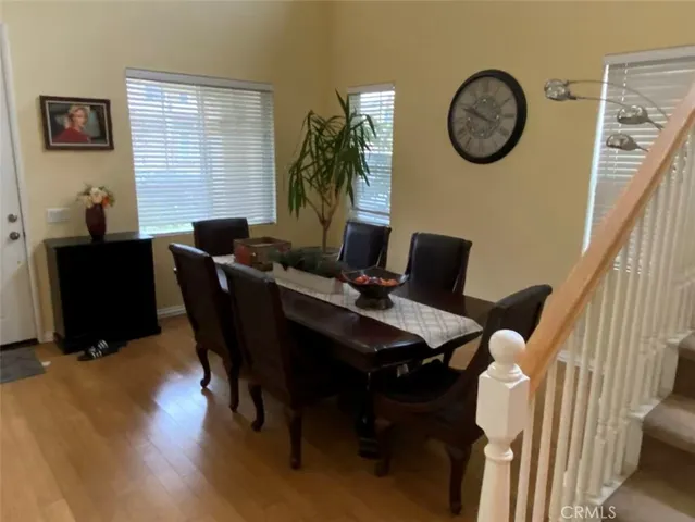 a view of a dining room with furniture and window