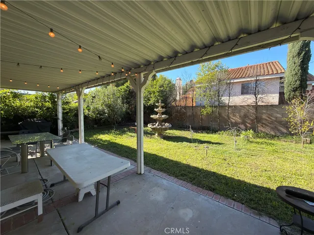 a view of a patio with swimming pool