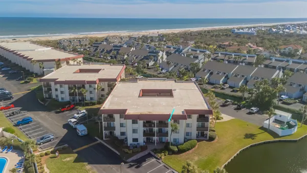 an aerial view of a house with a ocean view
