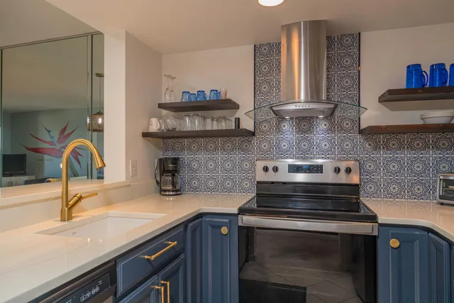a kitchen with a sink and a stove top oven
