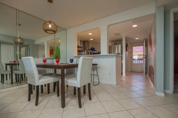 a dining room with furniture and window
