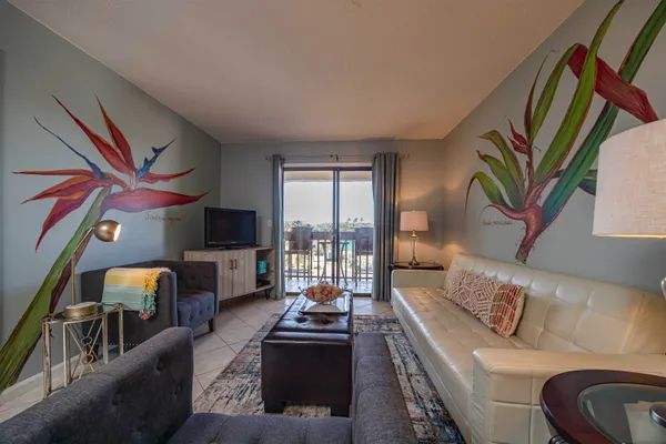 a living room with furniture and a flat screen tv