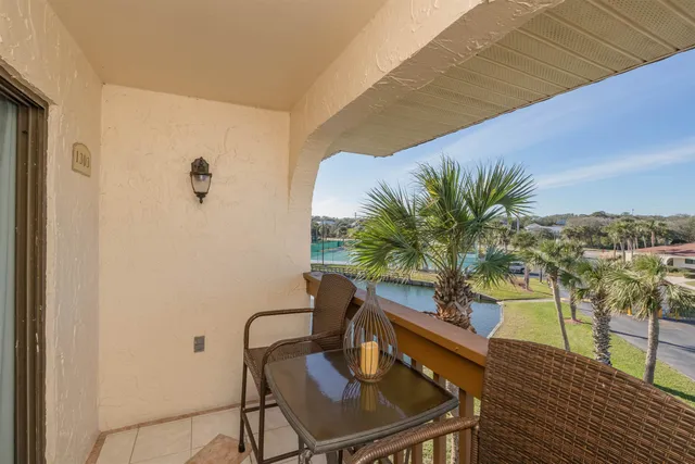 a view of a balcony with furniture