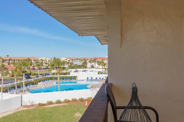a view of a balcony with an ocean view