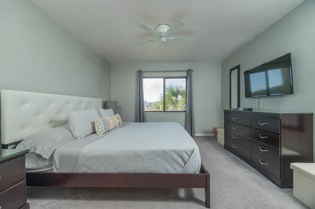 a bedroom with a bed and a dresser