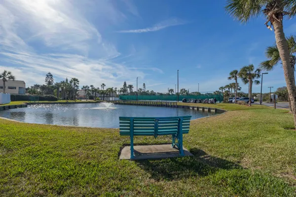 a view of a lake with outdoor seating and lake