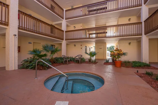 front view of a house with a fountain