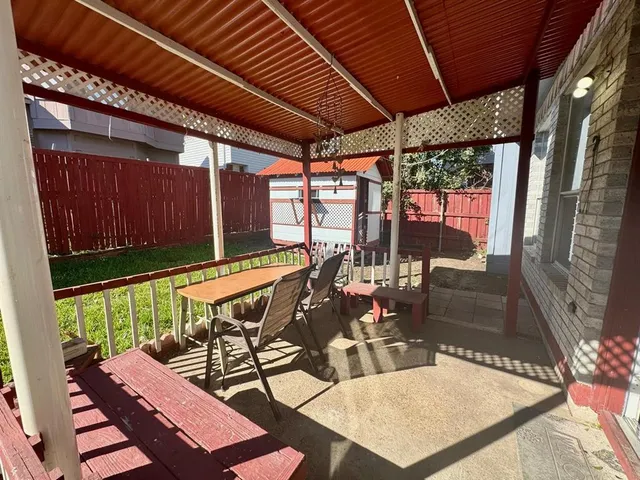 a view of an outdoor sitting area with furniture