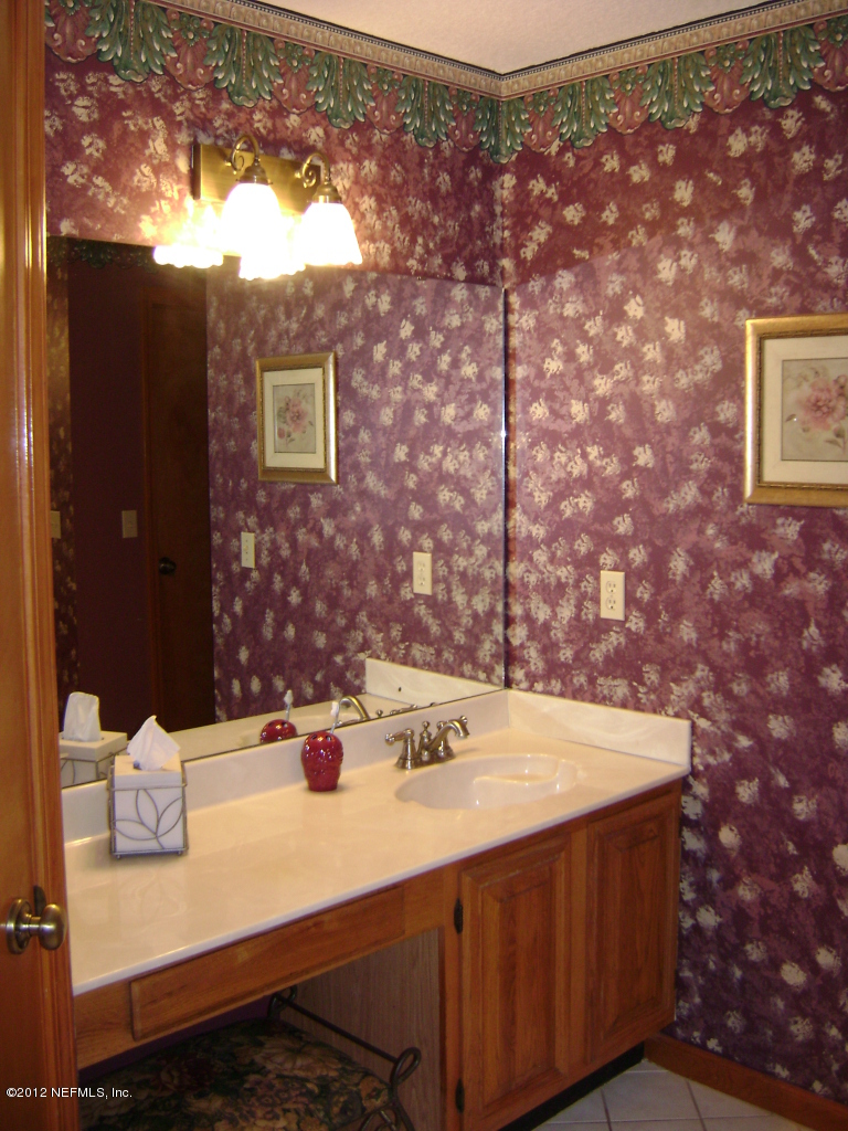 700 Roberts Road St. Johns, FL 32259 - Photo 13 of 19 a bathroom with a sink and a mirror