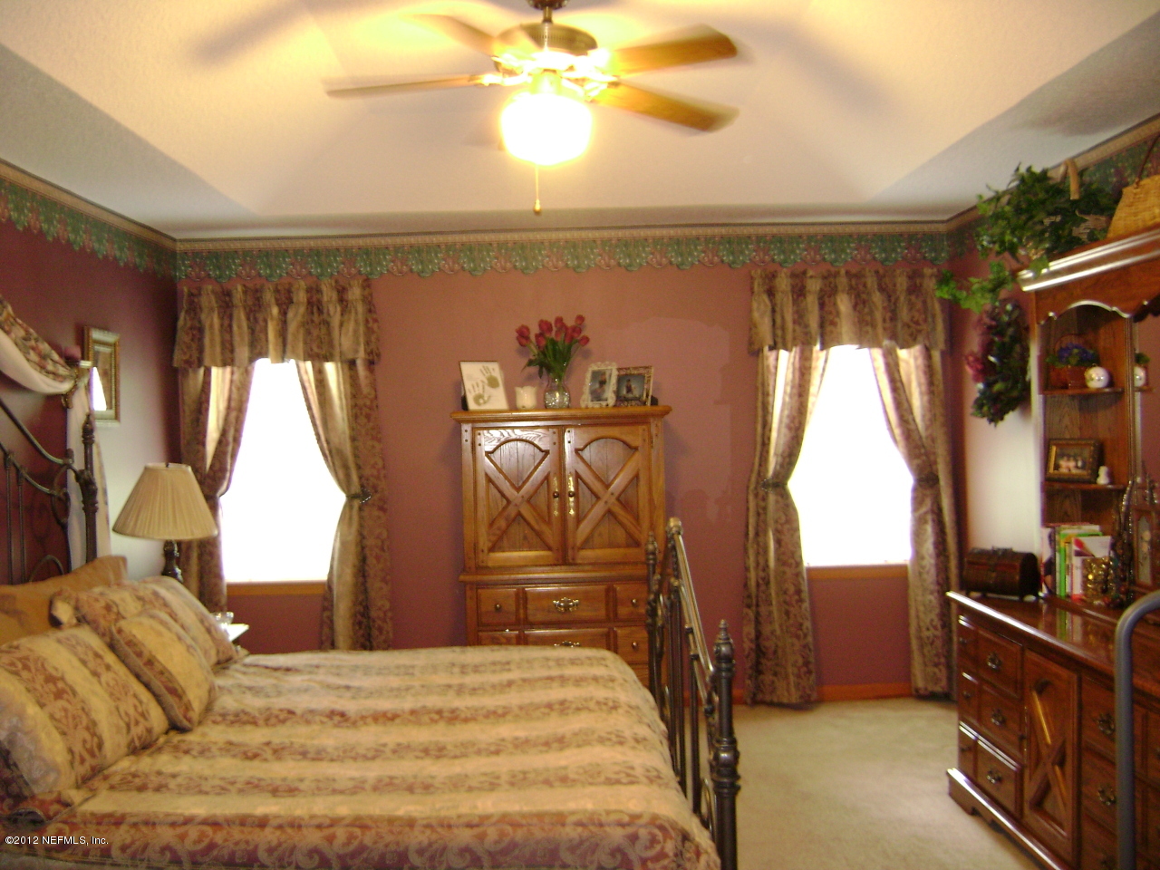 700 Roberts Road St. Johns, FL 32259 - Photo 8 of 19 a bed sitting in a bedroom next to a window