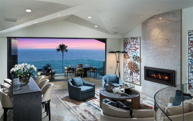 a living room with fireplace furniture and a fireplace