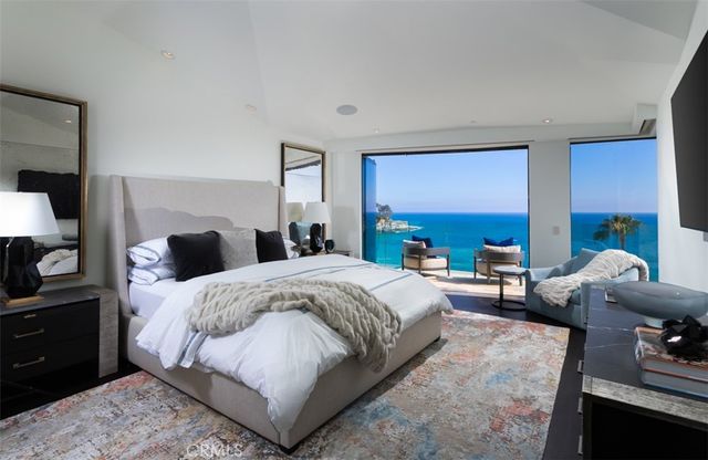 a spacious bedroom with a bed and a couch