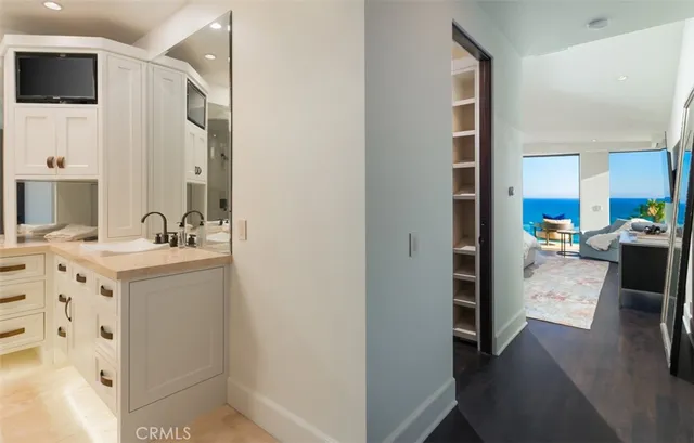 a bathroom with a sink double vanity and tub