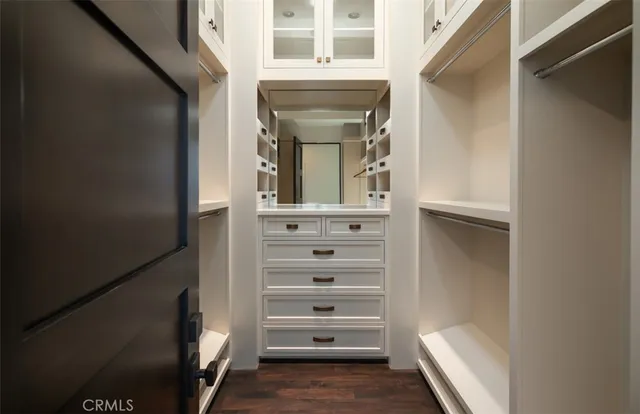 a bedroom with two beds and a lamp