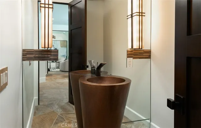 a utility room with sink dryer and washer