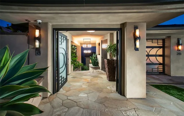 a view of a hallway with wooden walls and a couch