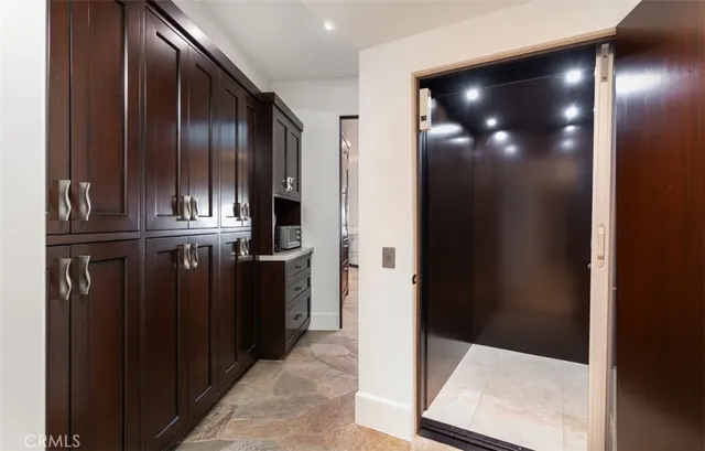 a building outdoor space with patio furniture and potted plants