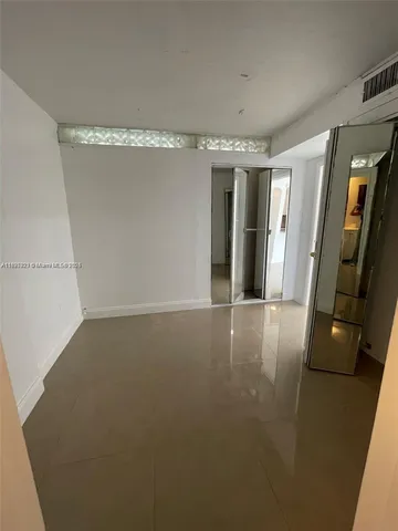 a view of gallery with wooden floor