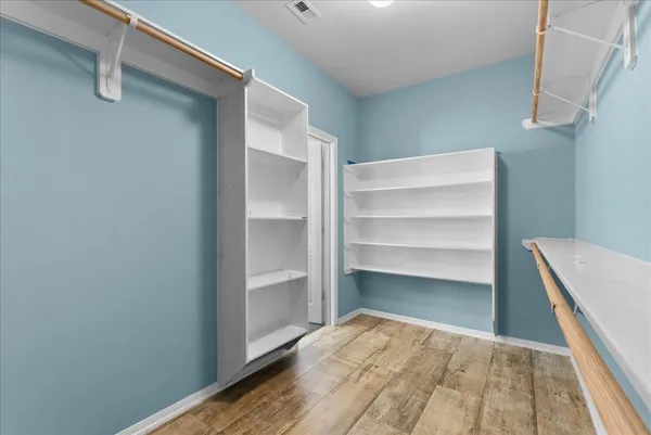 a view of an empty walk in closet