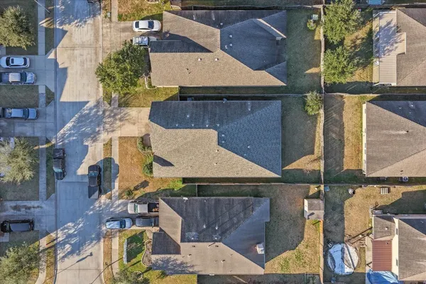 an aerial view of a house with a garden