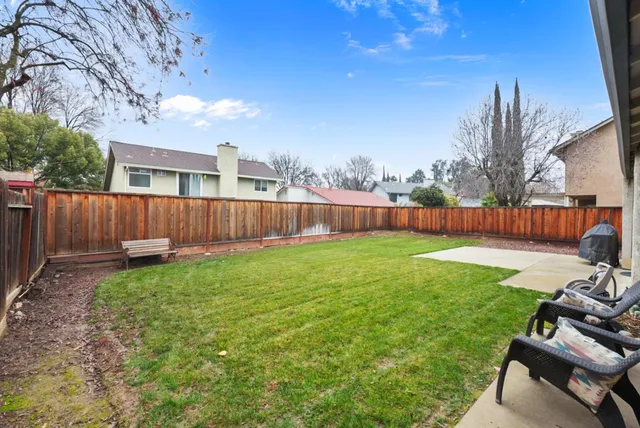 a view of a hallway with wooden floor and entryway