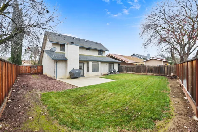 a kitchen with stainless steel appliances granite countertop a sink and a stove