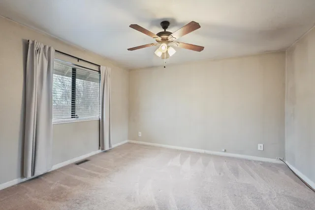 a view of a kitchen with stove and microwave