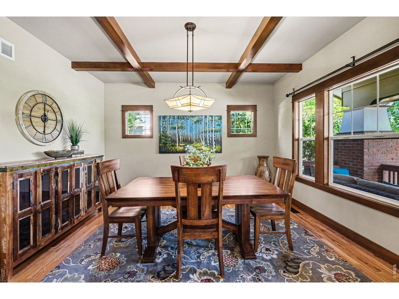 1302 Bennett Road Fort Collins, CO 80521 - Photo 6 of 36 Formal dining room featuring hardwood floors, high ceilings, wood beams and arched entry way.