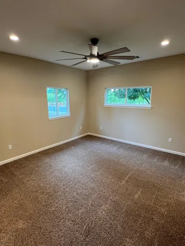 a bathroom with a shower and a toilet