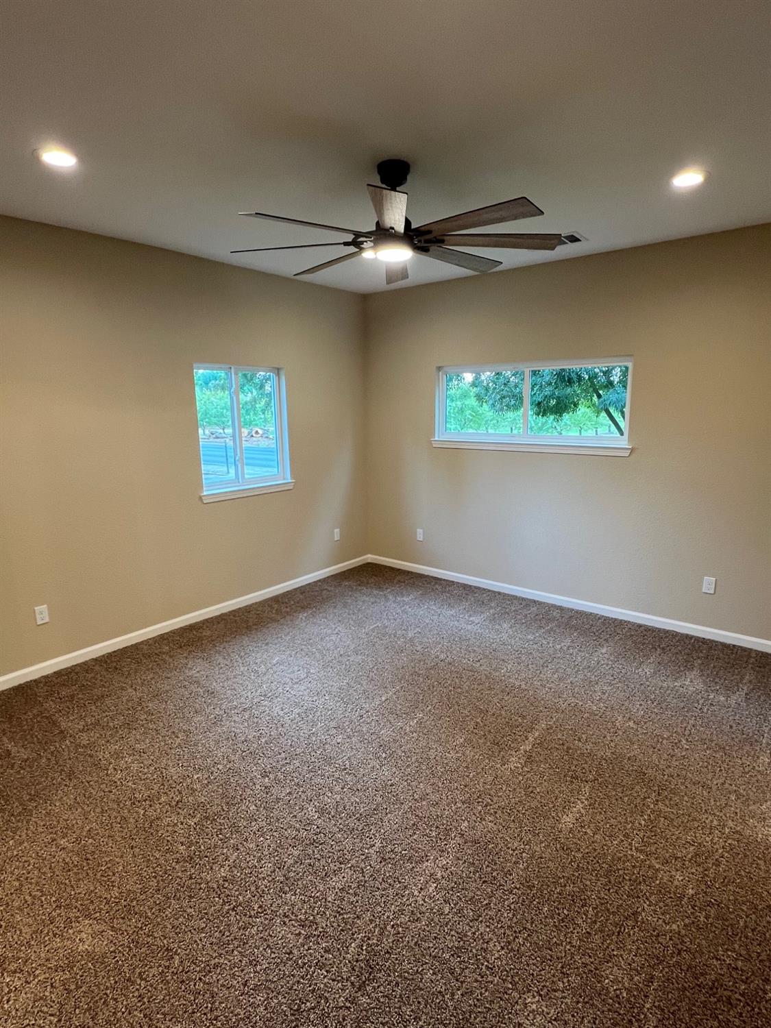10016 South Priest Road French Camp, CA 95231 - Photo 16 of 63 an empty room with a ceiling fan and a window