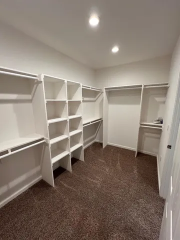 a bathroom with a granite countertop sink toilet a mirror and shower